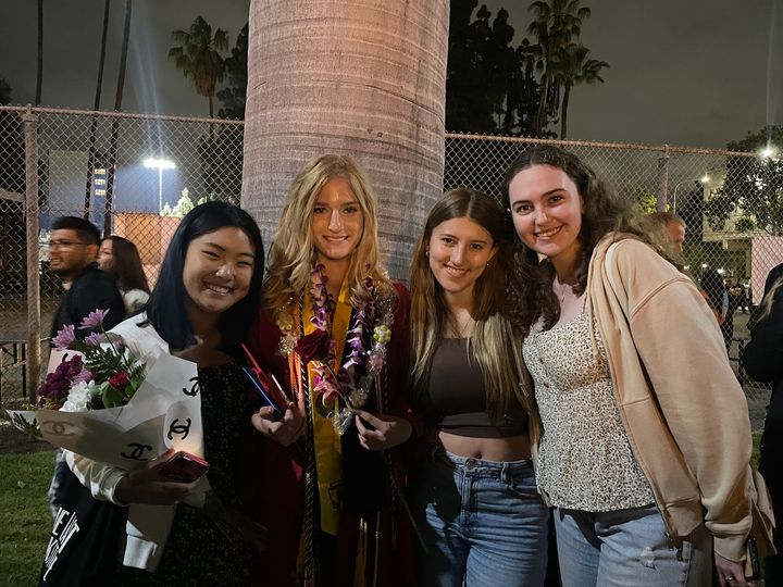 Los Alamitos High School graduate Sofia Youngs (second from left) and the author (left) pose with their friends after LAHS’s