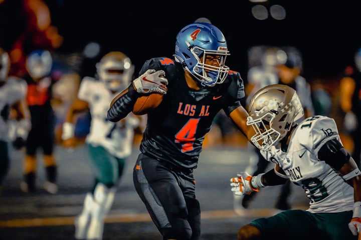 Los Alamitos High School running back Damian Henderson scored four touchdowns in the team's win over Long Beach Polytechnic o