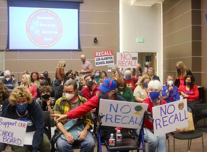 Supporters and opponents of an effort to recall members of the Los Alamitos Unified School District Board of Education attend