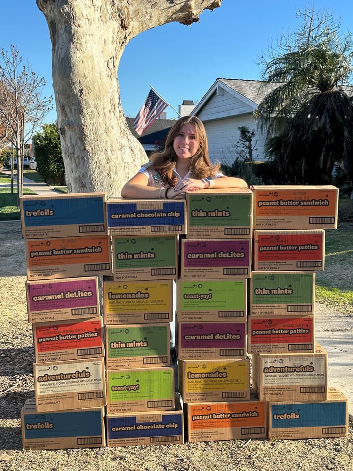 Girl Scout selling cookies to help save Monarch Butterfly