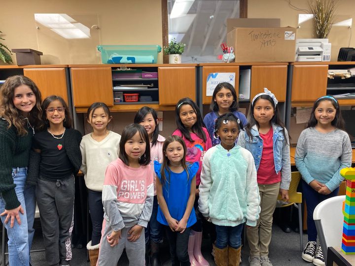 Los Alamitos High School senior Sarah Saadeh (far left) poses with participants in the Girls in STEM program she founded at T