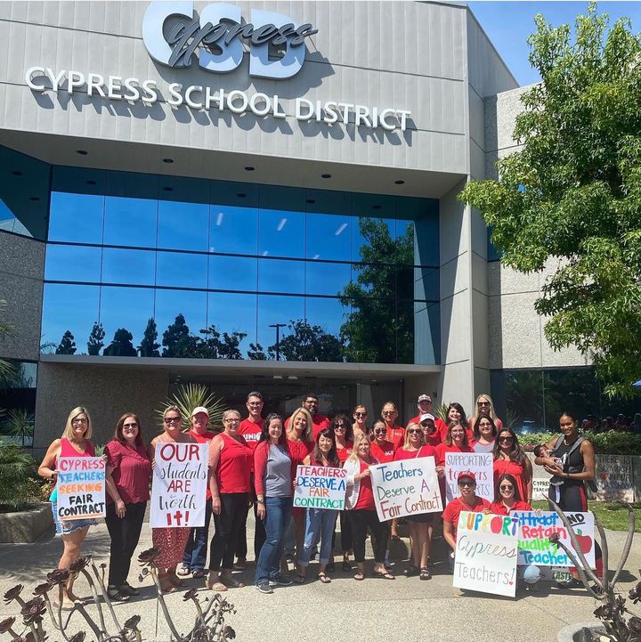Members of the Association of Cypress Teachers rally before mediation talks with Cypress School District in July. The two sid