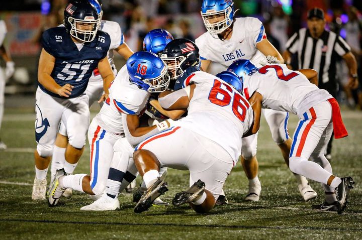 Los Alamitos overpowers Newport Harbor in 61-21 defeat. Photo by Marja Bene.