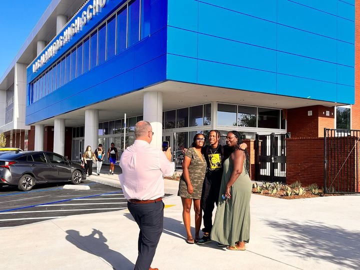 Smiles on the first day of school: Los Alamitos High School freshman Arron Myers poses with his mother and grandmother for a