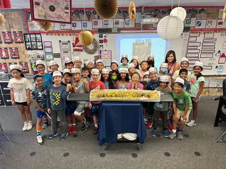 Weaver Elementary school teacher Christine Nguyen and students in her math class pose with a 100x100 In-N-Out burger that was