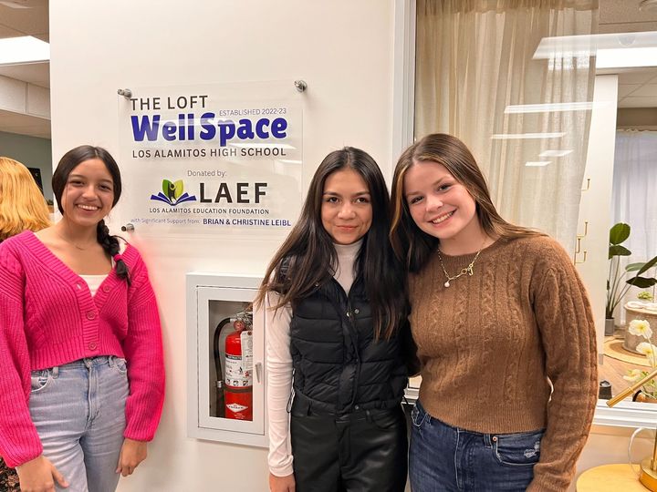 Los Alamitos High School students Isabella Martinez, Isabella Ruiz and Colby Ledterman pose inside 'The Loft,' the new WellSp