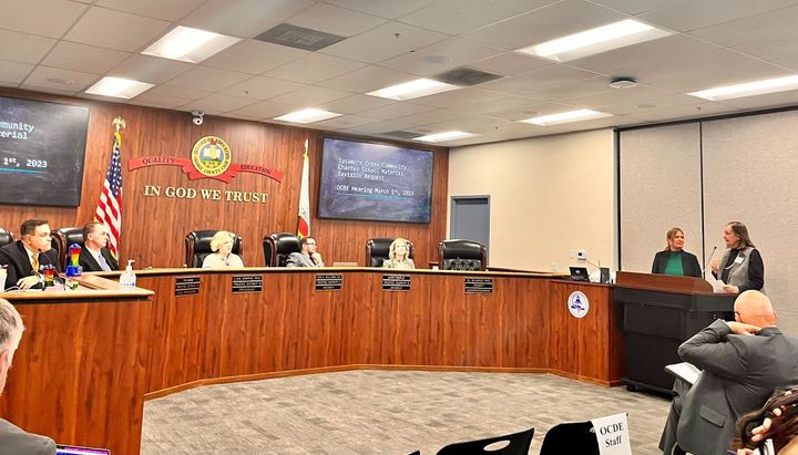 Orange County Board of Education trustees listen to representatives from Sycamore Creek Community Charter School during the b