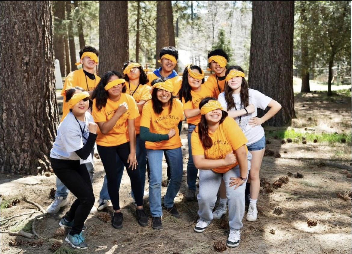 Team Peach, the Peachy Pirates, strikes a silly pose for their group picture. Photo by RYLA photographer.