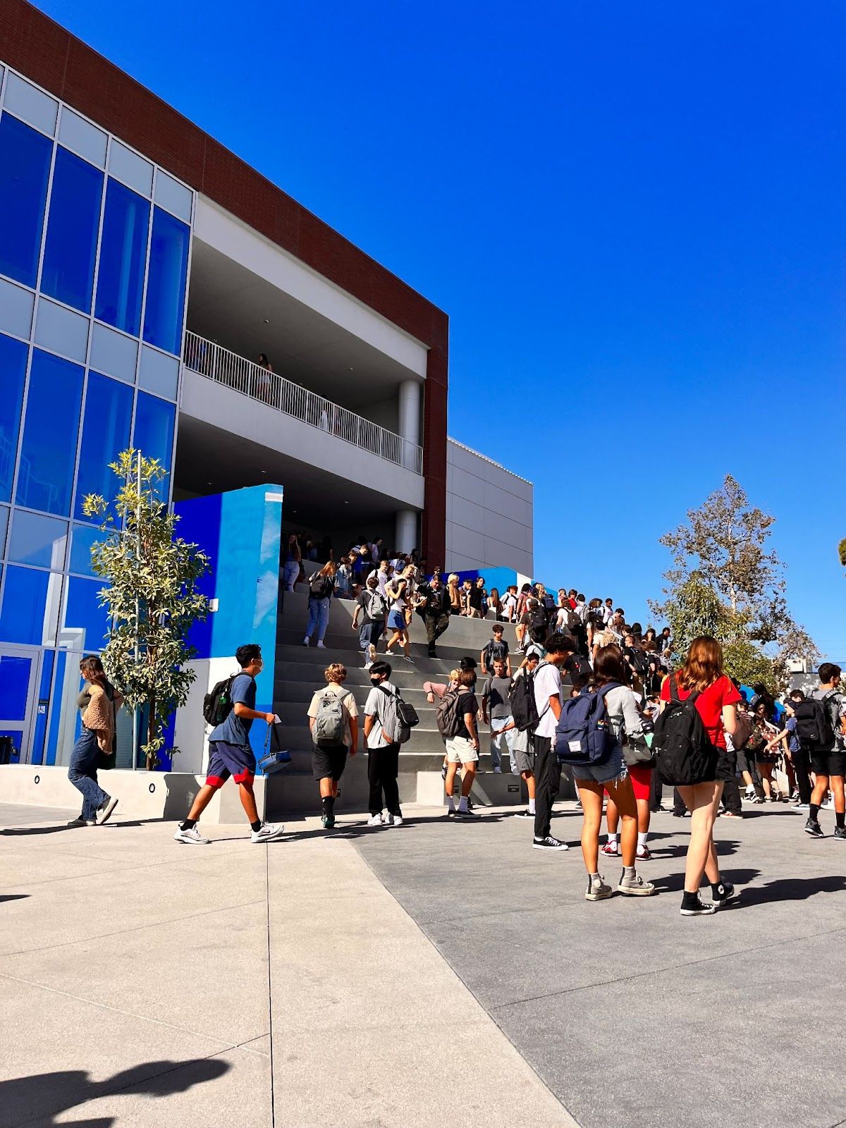Students walk up and down the 'grand staircase' of the new STEM building at Los Alamitos High School on the first day of school, August 15. It was the first day students were able to attend classes in the new $67 million building. Photo by Jeannette Andruss