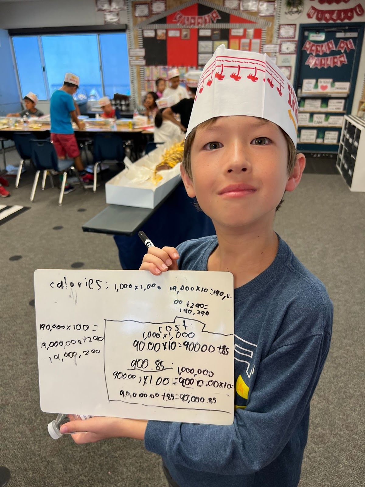 Third grader Elliott Coxhill shows his work while doing the math lesson trying to calculate the calories and costs of burgers on In-N-Out's secret menu. Courtesy photo.