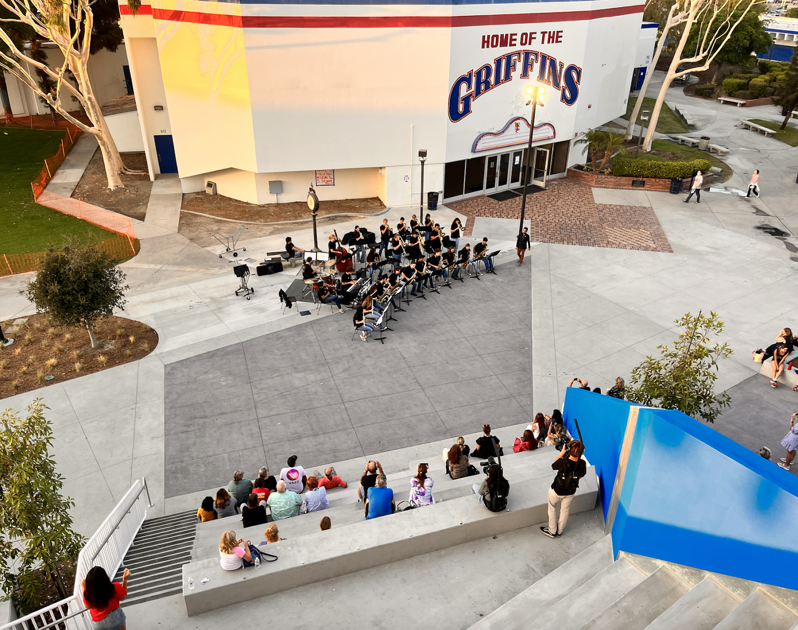 Visitors sit on the "grand staircase" of the new STEM building to enjoy a performance by the LAHS Jazz Band. Photo by Jeannette Andruss.