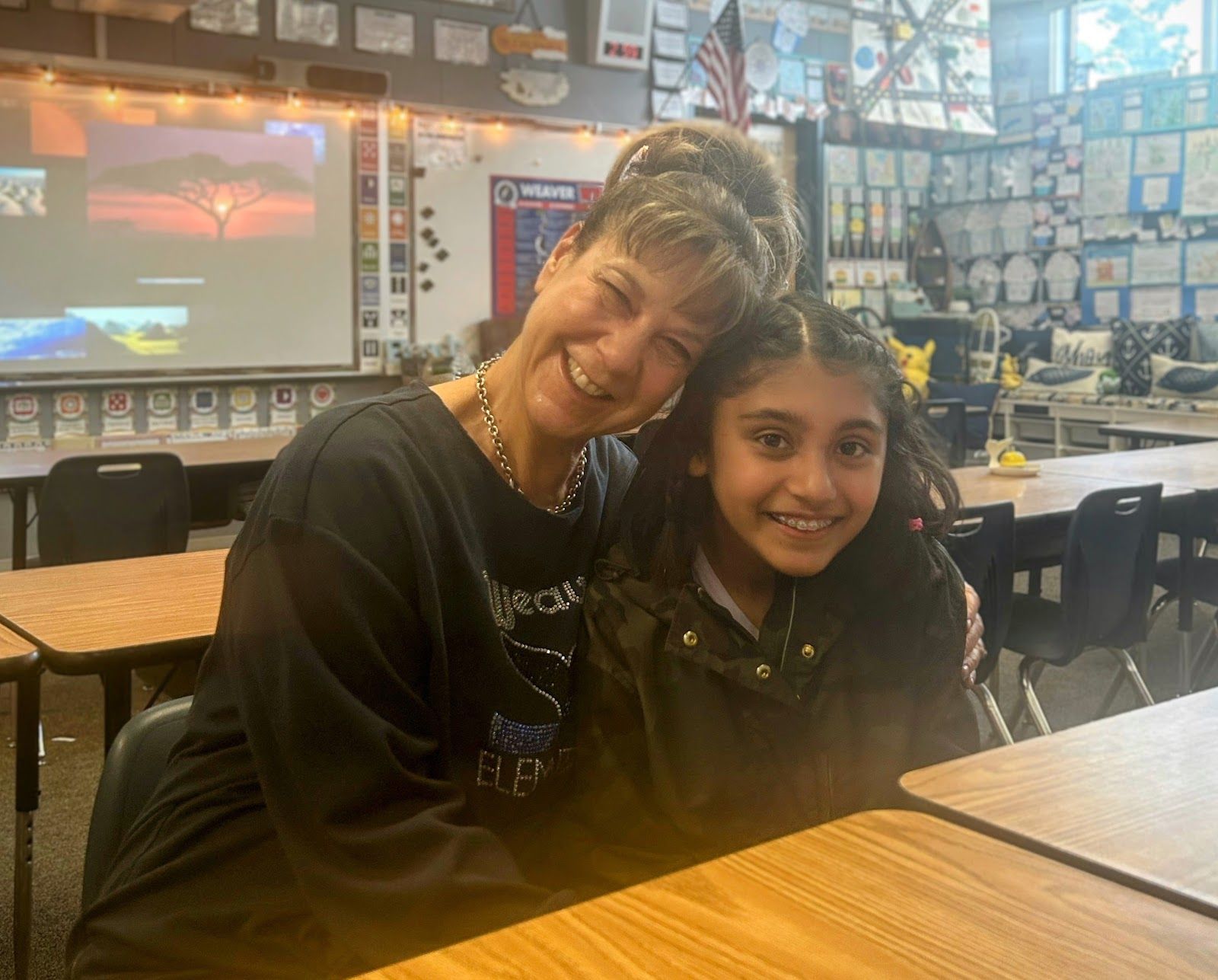 Kimi Vadher, founder of Weaver Elementary school's first student publication “Whale Tales,” with teacher Ruth Freedman-Finch, the adviser for the newsletter. Photo by Bella Kim.